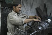 Steel worker in Islamabad: Pakistan has to weigh need for infrastructure spending against fiscal consolidation, IMF says (photo: Ton Koene/Newscom). 
