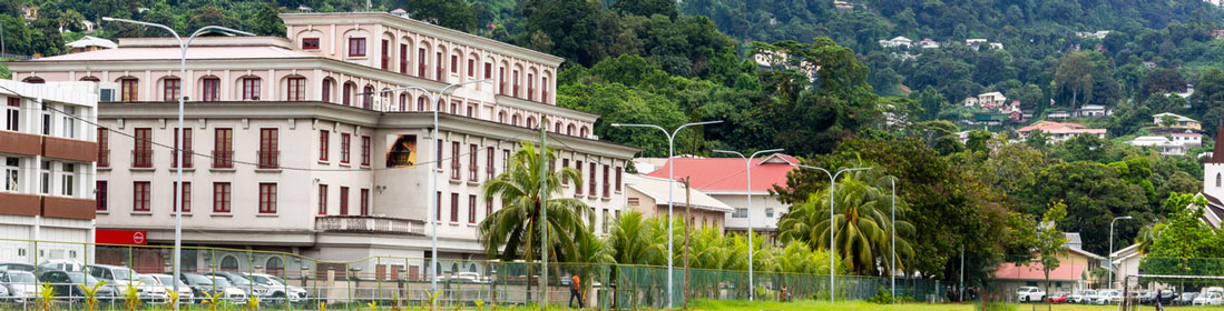 Victoria, Seychelles, 04.05.2021. Victoria town landscape view with colonial style office buildings on Independence Avenue seen from Freedom Square Grounds with cloudy mountains in the background. (iStock/Aleksandra Tokarz)