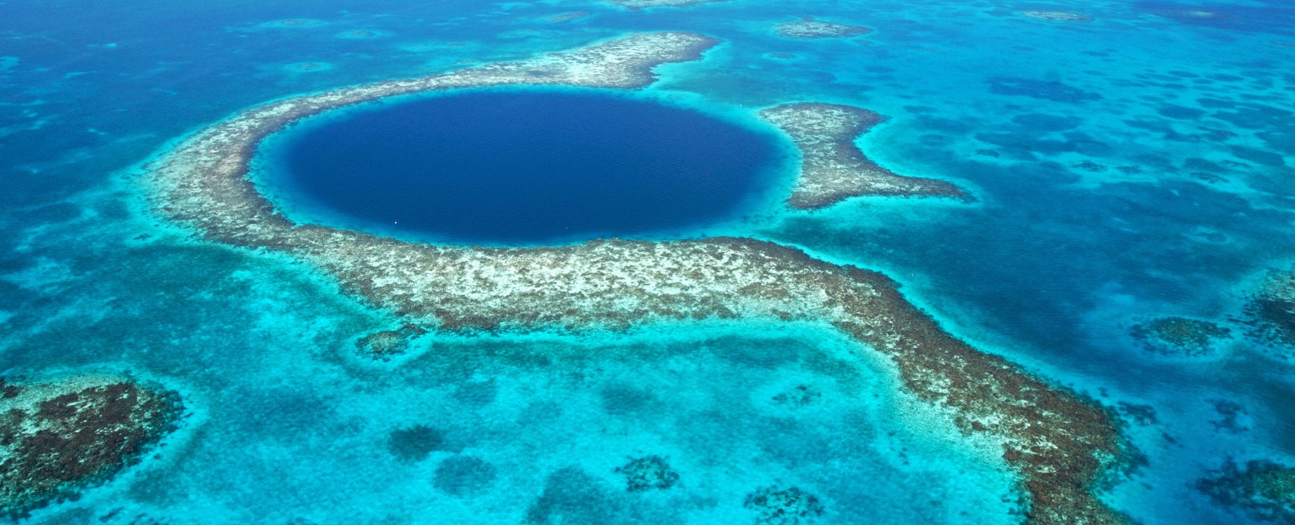 The Great Blue Hole in Belize is a giant underwater sinkhole.