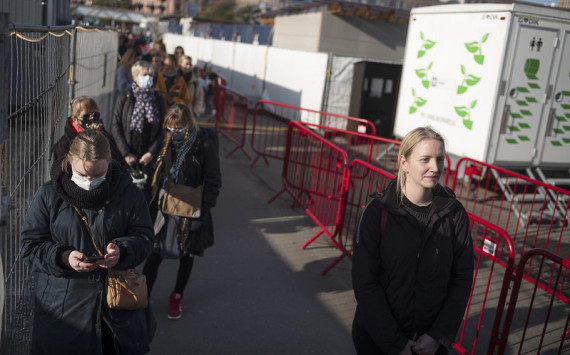 People line up for COVID testing in Copenhagen, Denmark. The population has maintained a high level of trust in the country’s health authorities during the pandemic. (Photo: Sofia Busk/IMF)