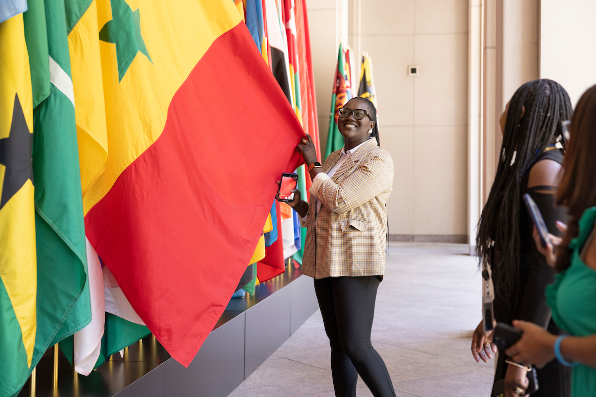 IMF staff find their countries’ respective flags outside of the IMF building. 