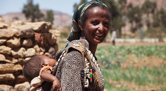 Ethiopian mother with child.  The country has enjoyed important welfare gains including a dramatic fall in the number of maternal deaths (photo:  Chris Bradley/Newscom)