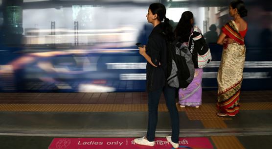 Women wait for a train in Mumbai, India. Implementing labor market reforms in the country can support more women in the workforce (photo: Xinhua/Sipa USA/Newscom)