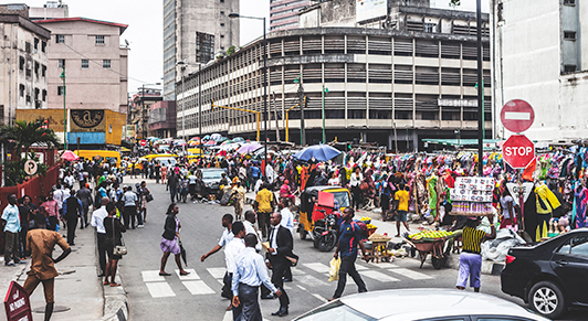 People walking in downtown streets, Lagos, Nigeria. The country needs to mobilize resources to invest in people. (iStock/peeterv)
