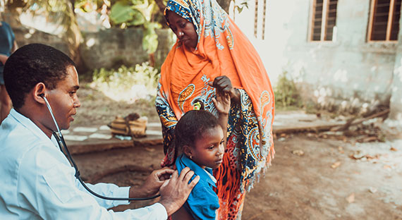A doctor checks a child, Zanzibar, Tanzania. Regional policies should remain focused on safeguarding public health, supporting people and businesses hardest hit by the crisis, and facilitating the recovery. (photo: zeljkosantrac/iStock by Getty Images)
