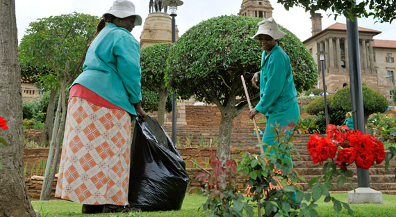 Gardeners tending the lawn at the seat of government in the capital Pretoria.  The authorities have used different tools to tackle stubborn levels of inequality (photo: Gero Breloer/picture-alliance/dpa/Newscom)