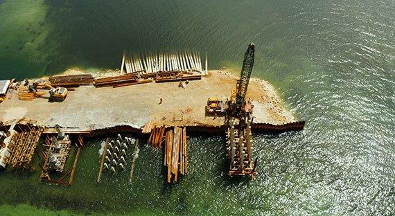 Bridge under construction across the bay at Siargao, Philippines. The government’s <i>Build Build Build</i> program includes large projects that address transportation bottlenecks (photo: iStock/Alexpunker)