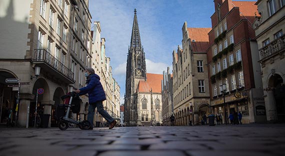 An almost deserted square in Münster, Germany. A large second wave and new lockdowns are threatening the recovery in Europe. (photo: Rolf Vennenbernd dpa picture alliance Newscom)