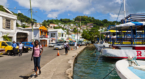 People walk by a waterfront in St. George's, Grenada, which has been a member of the Caribbean Community (CARICOM) since 1974 (photo: iStock/oriredmouse)