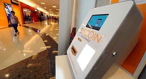 A Bitcoin dispensing machine at an underground shopping mall in Singapore: the country is looking at fintech to help advance the skillset of its citizens (photo: Then Chih Wey Xinhua News Agency/Newscom)