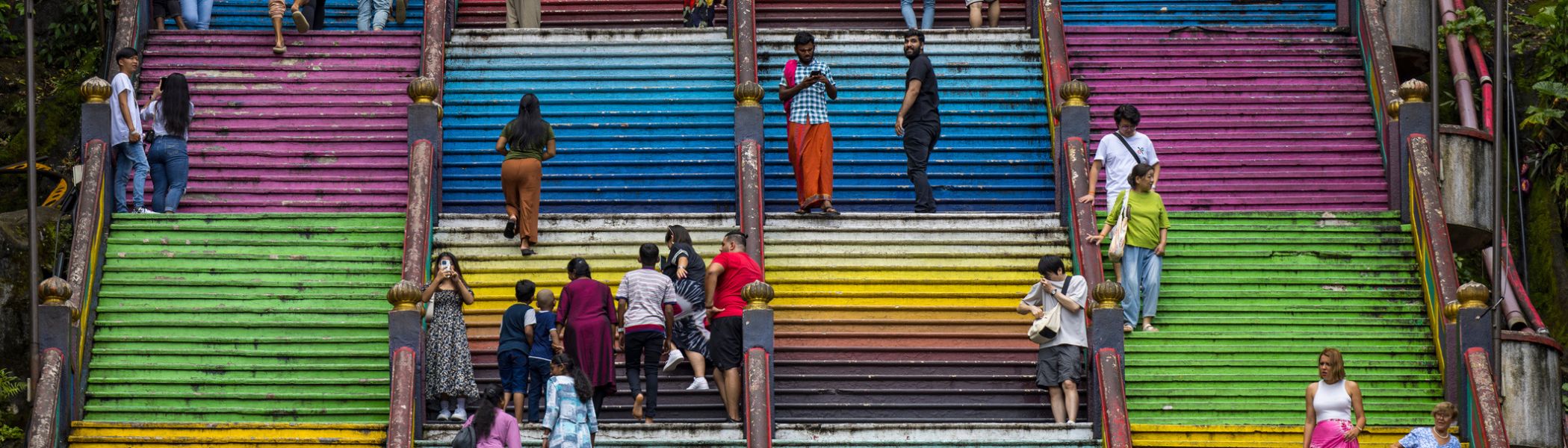  colorful staircase at batu caves, kuala lumpur in malaysia. a very steep walk up to the cave.