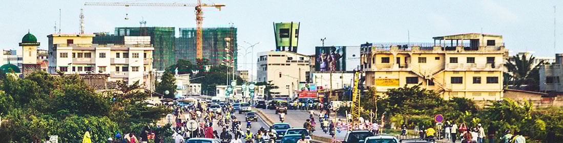 City traffic just before sunset.  Cotonou, Benin, West Africa.