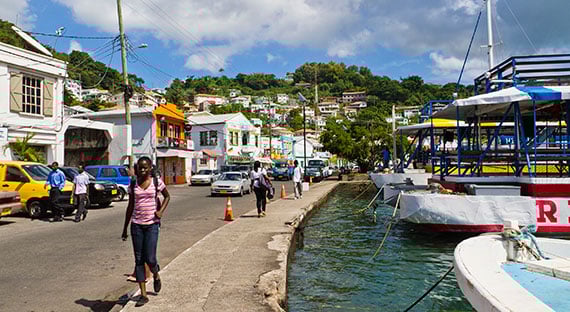 People walk by a waterfront in St. George's, Grenada, which has been a member of the Caribbean Community (CARICOM) since 1974 (photo: iStock/oriredmouse)