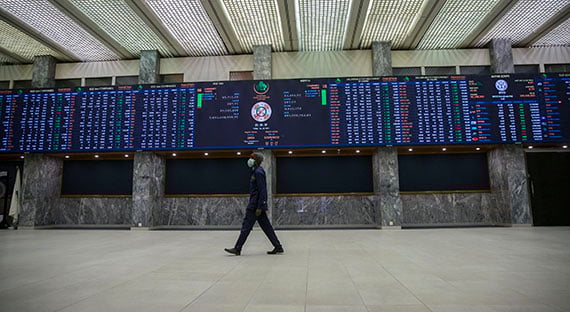 A man walking in the Pakistan Stock Exchange building. The pandemic has increased financing needs in Pakistan and other countries across the region. (photo: IMF)