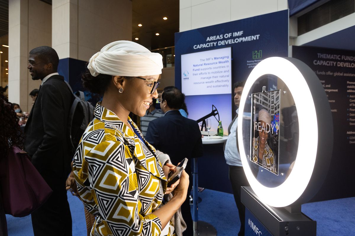 An attendee taking a selfie at the Photo Booth.