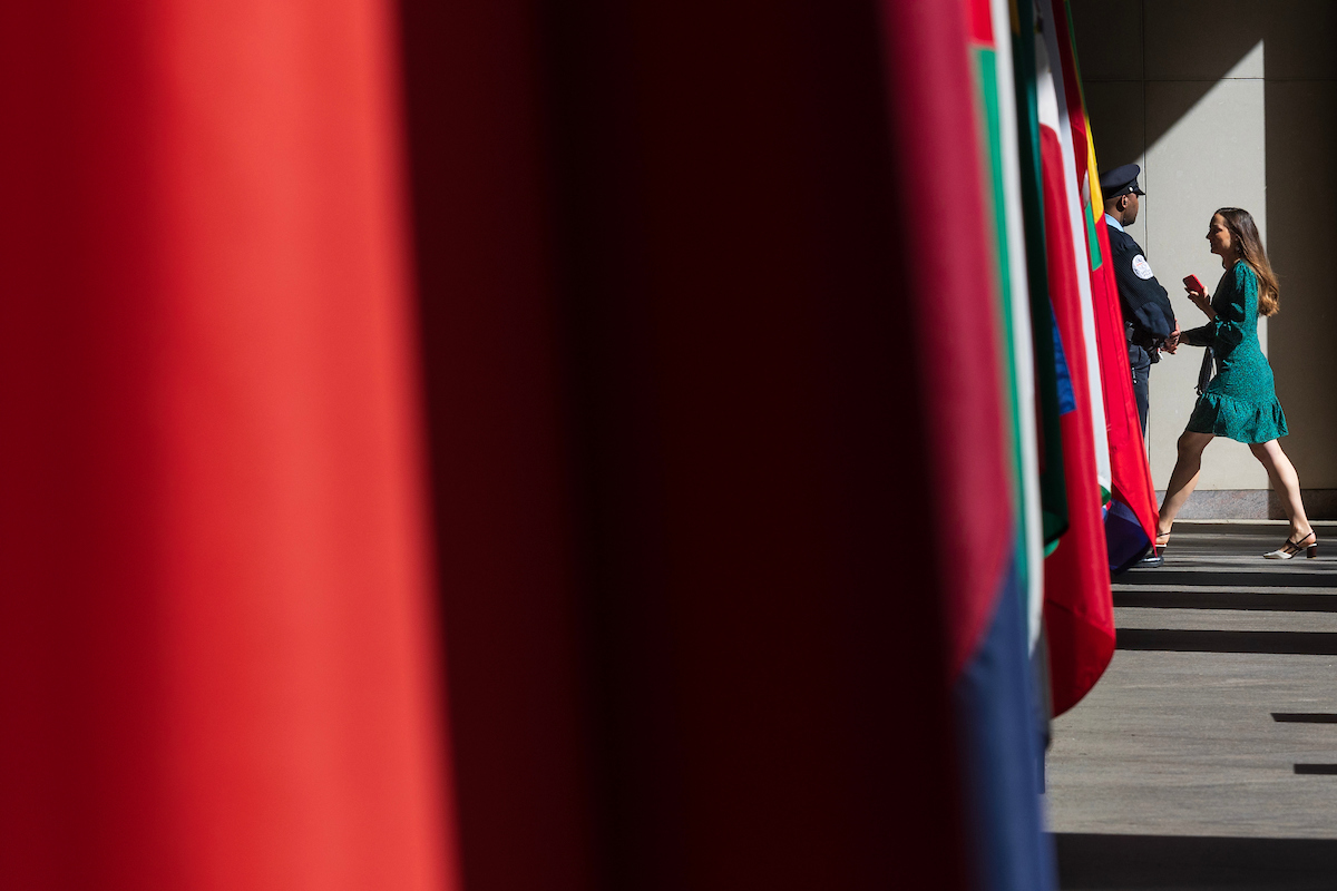 A security officer stands guard outside an entranceway