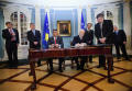 President of the Republic of Kosovo Fatmir Sejdiu (R) and Prime Minister of the Republic of Kosovo Hashim Thaci (L) sign Articles of Agreement of the International Monetary Fund (IMF) and the International Bank for Reconstruction and Development (World Bank)  June 29, 2009 at the State Department in Washington, DC. IMF Photo /Stephen Jaffe