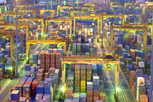 Singapore port at night.  After a subdued year in emerging Asia, external demand will help fuel a pickup in growth in 2013 (photo: Justin Guaraglia/Corbis) 
