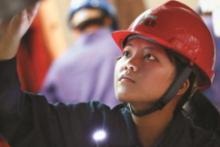 Woman installing a thermal power unit at an electricity power plant in Qujing, Yunnan Province, China; more women in the labor force, especially in aging populations, boosts economic growth (photo: Zhang Jiang Tao/Redlink/Corbis) 