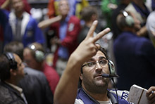 A trader in Chicago after the Federal Reserve announced it would buy more assets: recent monetary policies have supported the economy according to the IMF (photo: John Gress/Corbis) 