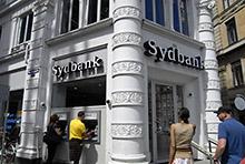 Bank customers in Copenhagen: The IMF is encouraging strong financial sector coordination across the Nordic region (photo: Francis Dean/Corbis) 