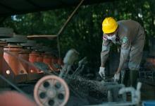 A worker extracting lead and zinc from ore in Bogor, Indonesia. An emerging market growth slowdown could hurt commodity prices, particularly metal (photo: Darren Whiteside/Reuters/Corbis) 