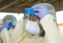 Health workers suit up in Conakry, Guinea, amid aggressive government efforts to control Ebola epidemic (photo: David Snyder/ZUMA Press/Newscom) 