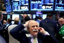 Trader on the New York Stock Exchange: higher uncertainty could lead to more financial turmoil (photo: Justin Lane/epa/Corbis) 