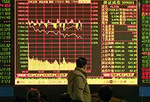 &Eacute;cran boursier en Chine. Avec la multiplication des d&eacute;bouch&eacute;s sur les march&eacute;s &eacute;mergents les flux obligataires sont devenus plus volatils (photo&nbsp;: Bei Feng/Corbis) 