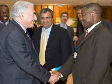 Dominique Strauss-Kahn greets Andrew Kumbatira of the Malawi Economic Justice Network