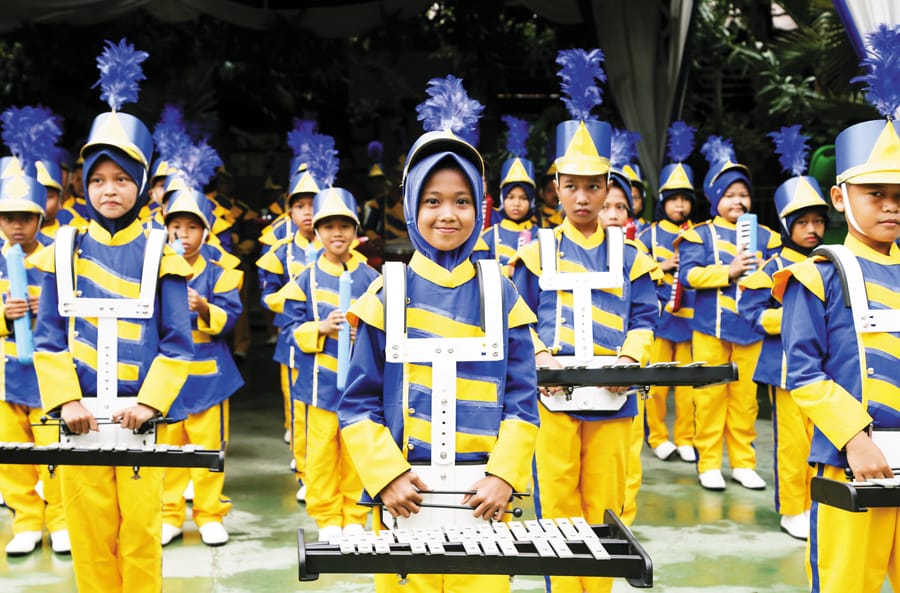 A children’s marching band in full regalia