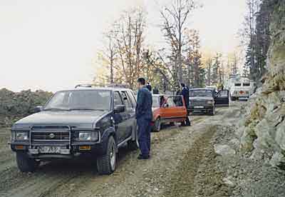 An IMF and World Bank team prepares to cross Mount Igman to assess reconstruction needs in Bosnia after a cease-fire in 1995.