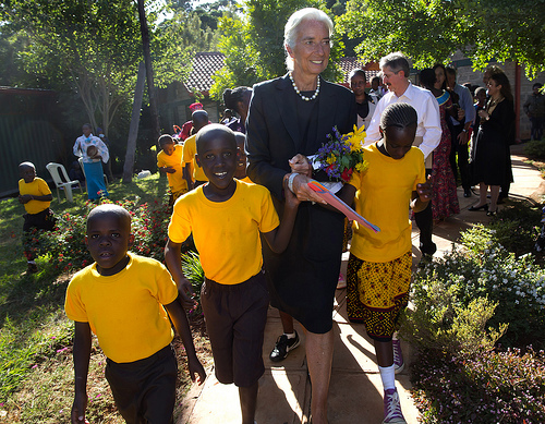 International Monetary Fund Managing Director Christine Lagarde walks with some children after she visited the Nest Home, an orphanage and halfway house for children January 7, 2014 in Nairobi, Kenya. Lagarde is on a two country visit to Africa. IMF Photograph/Stephen Jaffe