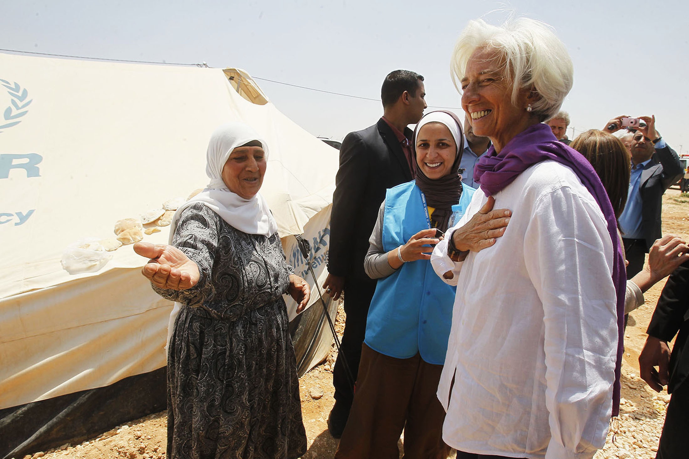 Christine Lagarde, IMF Managing Director, speaks to Syrian refugee woman during visit to Syrian al-Za'atari refugee camp in Mafraq city