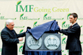 International Monetary Fund Managing Director Dominique Strauss-Kahn (L) accepts the LEED Gold Award from the U.S. Green Building Council President Peter Templeton (R) in recognition of the Fund's achievement of the highest environmental designation for its headquarters buildings.(IMF photo) border=