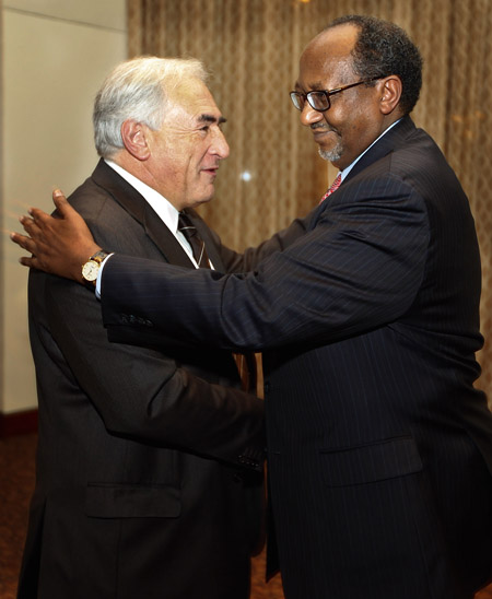 IMF Managing Director Dominique Strauss-Kahn greets Ambassador Roble Olhaye of Djibouti, Dean of African Ambassadors in U.S., at the start of a meeting at IMF headquarters on January 29, 2009 in Washington on the upcoming conference, 