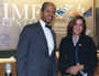 Lucia Casaravilla, IMF staff member, and Washington DC Mayor Williams pose for photos in the IMF Center