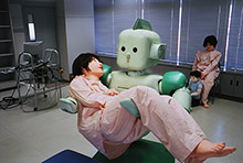 A robot developed in Japan to care for the sick. But in most of the care sector, robots still cannot substitute for human beings (photo: Gellie/Corbis) 