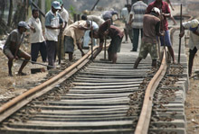 Sri Lankan railway workers: Reforms to the debt limits policy would help countries manage debt prudently while still allowing them to invest in much-needed development (photo: Newscom) 