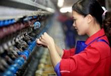Silk factory worker in China (photo: Tan Kaixing/FeatureChina/Newscom) 