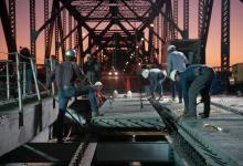 Workers repair bridge in the United States. With sluggish global recovery, more infrastructure investment can be a powerful impetus for growth and jobs (photo: Jim Sugar/Corbis) 