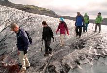 Tourists on a guided hike on Sólheimajökull glacier, Iceland. Revenue from tourism has helped Iceland rebound from the 2008 crisis (photo: William Gray/JAI/Corbis) 