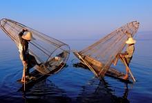 Fishermen on Inle lake in Myanmar.  Increased tourist traffic to the lake has spurred the construction of new hotels and expansion of tour operators (photo: Bruno Morandi/Hemis/Corbis). 